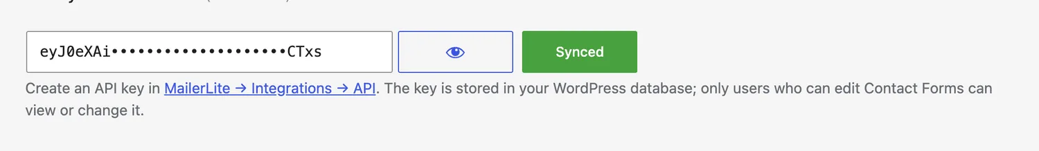 A verified MailerLite API key: masked value, reveal toggle, and the green Synced state.